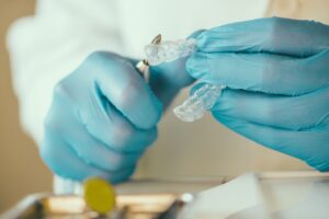 dentist preparing invisalign for whitening teeth 2021 08 26 16 53 24 utc 1 1
