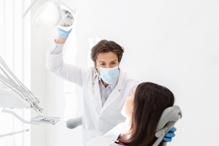 attentive dentist listening to female patient in c 2022 12 16 07 32 45 utc 2