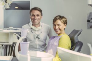 dentist and patient smiling at camera portrait 2022 12 16 22 33 07 utc 2